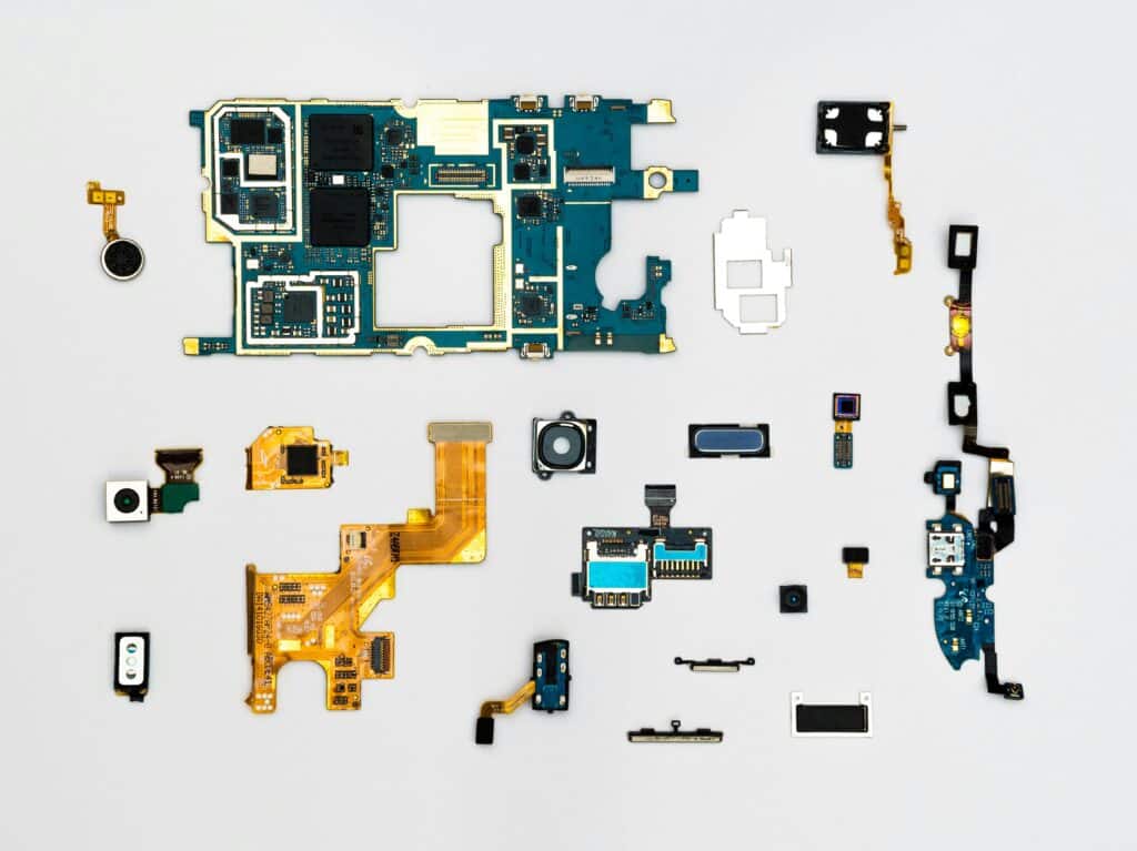 pexels-photo-1476321-1476321 Exploded view of smartphone components showcasing intricate technological design.